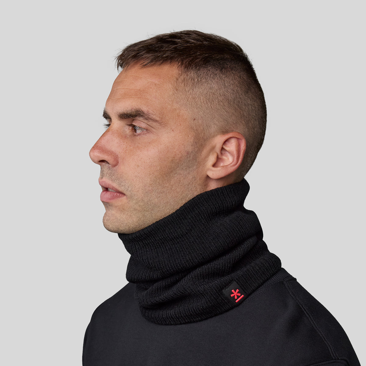 Man wearing the black Neck Warmer.